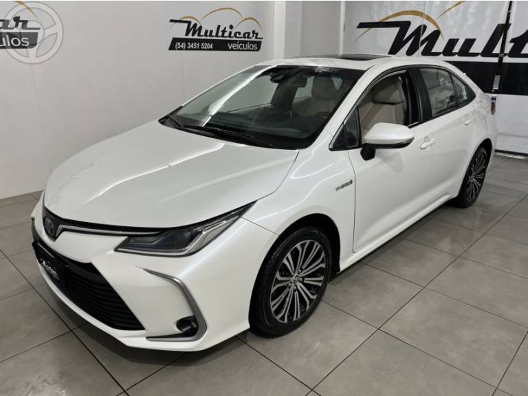TOYOTA - COROLLA 1.8 ALTIS PREMIUM 16V HÍBRIDO 4P AUTOMÁTICO - 2021/2021 - BRANCA - R$ 132.900,00